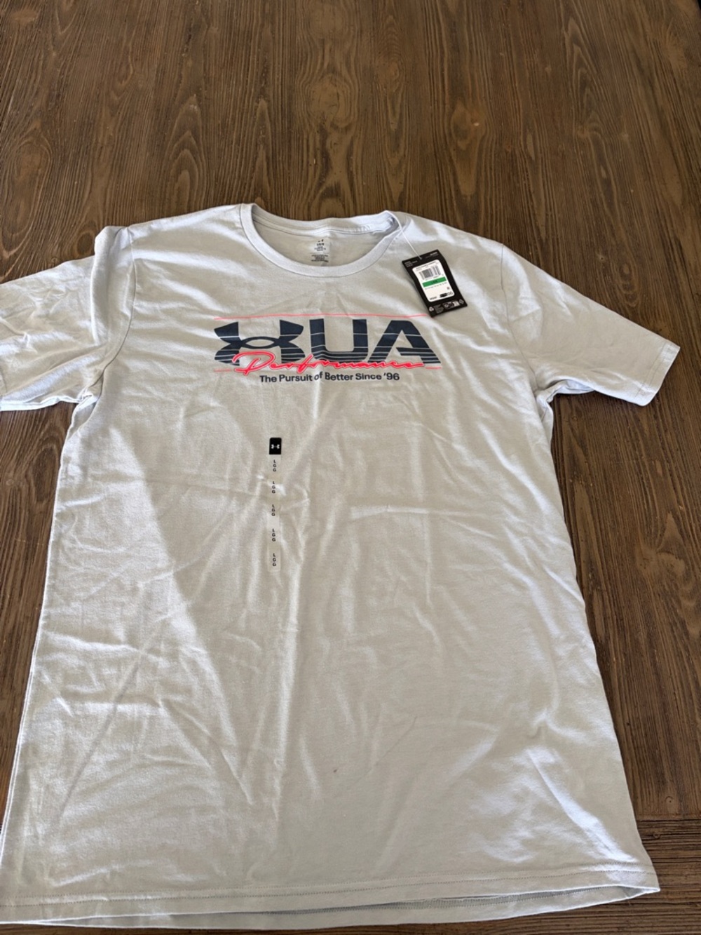 Under Armour Men’s White Short Sleeve Logo Tee with Navy and Pink Graphic